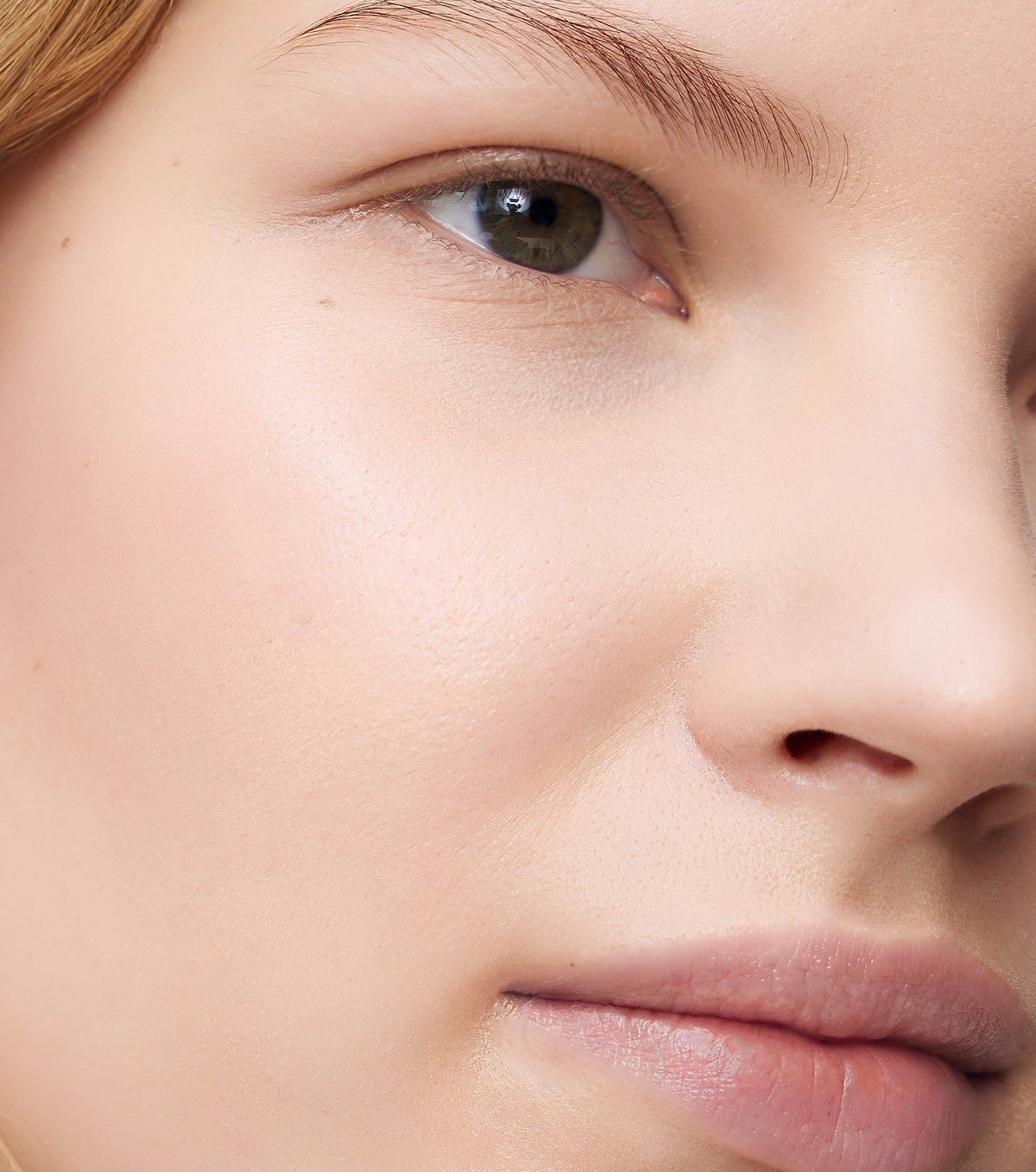 Close-up of a person's eye and nose with a blurred background