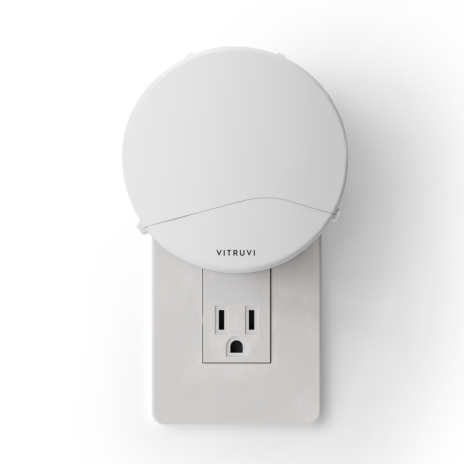 White plug in diffuser attached to a wall outlet with 'Vitruvi' branding on a white background