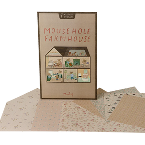 A pack of wallpaper with seven stickers designed for a Mouse Hole Farmhouse, showing rooms with different prints and colors.