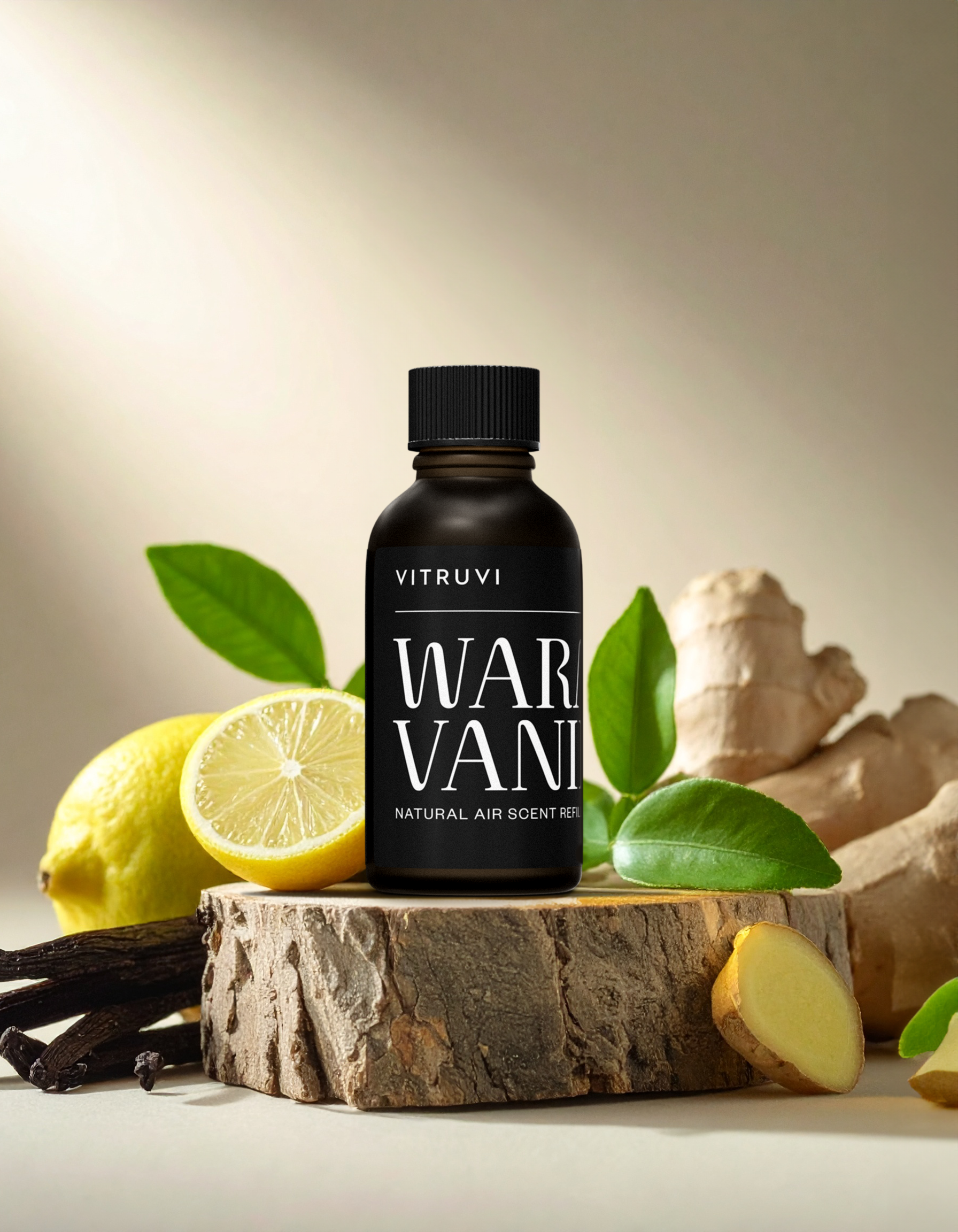 Vitruvi Warm Vanilla air scent bottle with lemons, ginger, and vanilla on a wooden block.