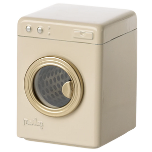 An off-white, metal Maileg washing machine toy with a visible spinning wheel and control knobs.