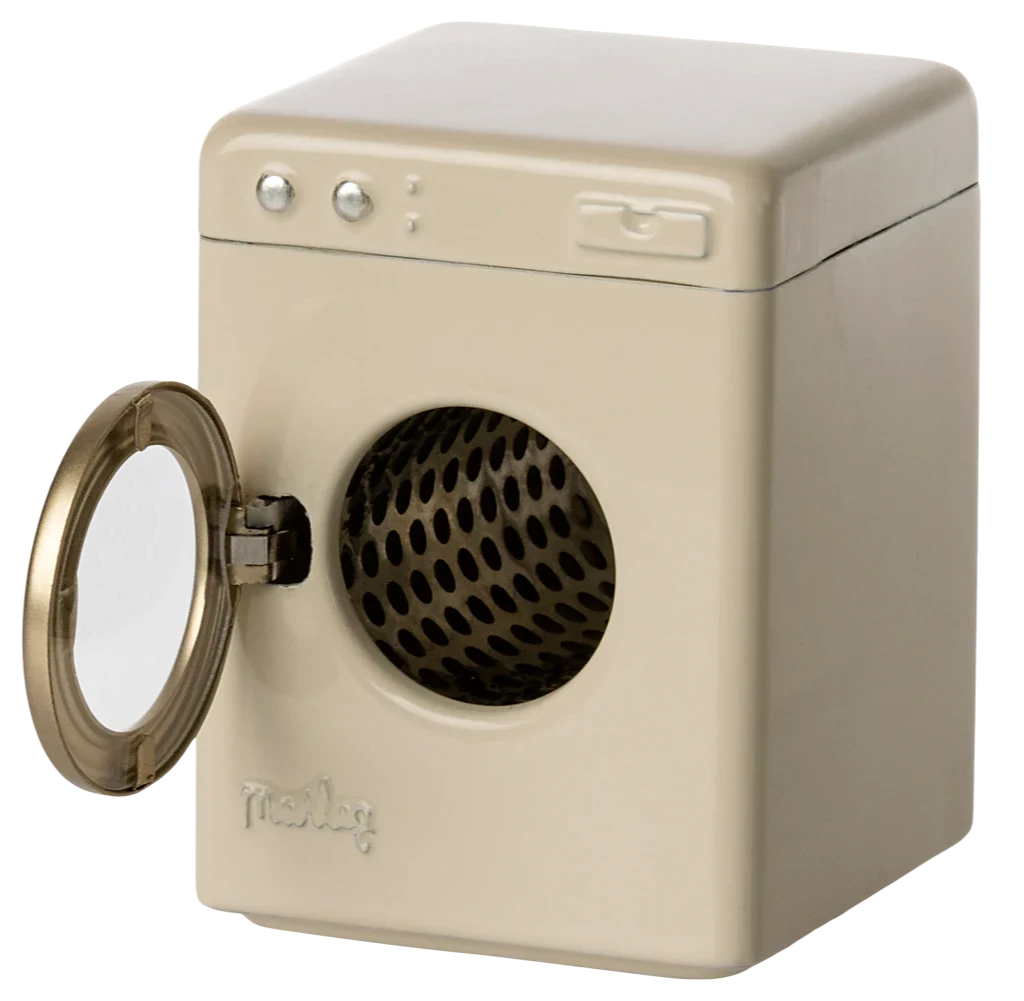 An off-white, metal Maileg washing machine toy with a visible spinning wheel and control knobs.