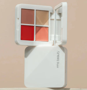 A white RMS Lip2Cheek compact on top of another one. 