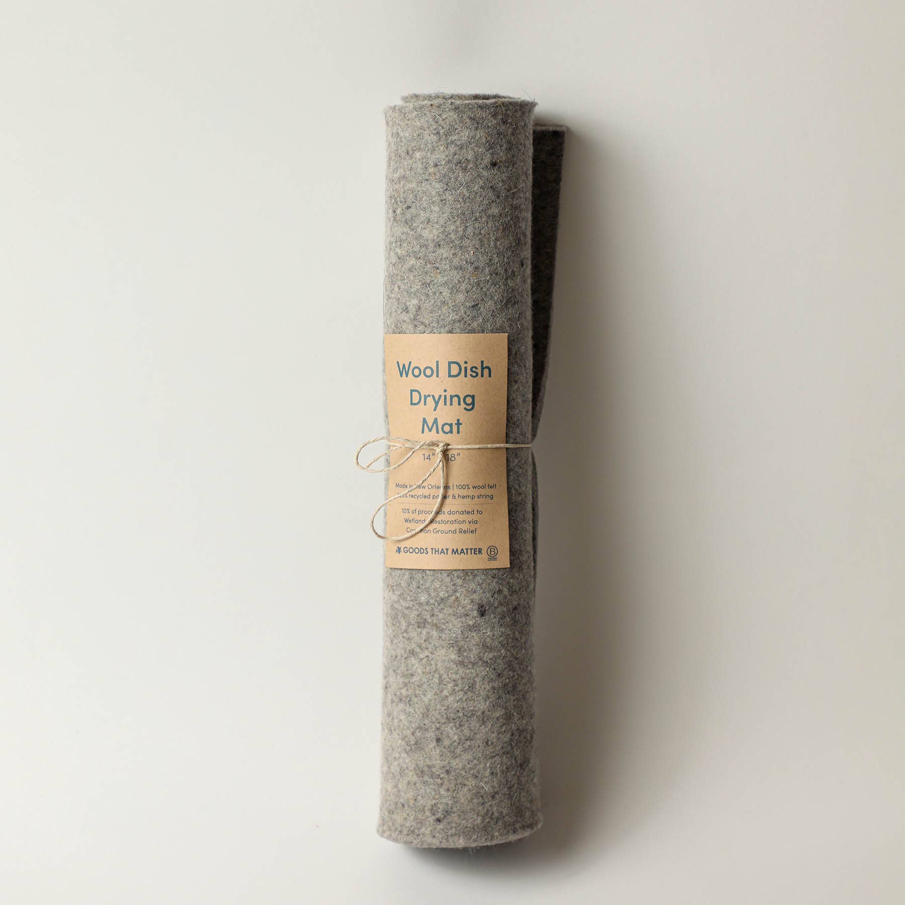 Three rolled-up dish drying mats with labels, set against a light background.