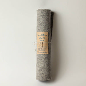 A wool dish drying mat on a light surface. 