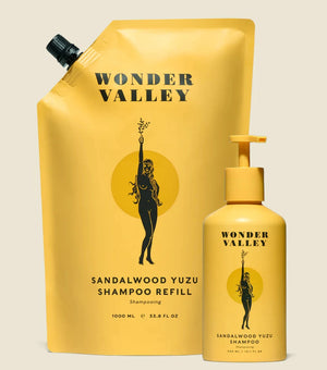 A bottle and refill bag of the Sandalwood Yuzu hair shampoo, made by Wonder Valley in California